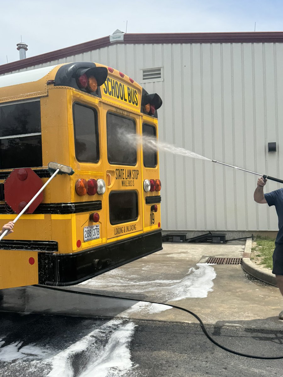 DrClintFreeman's tweet photo. Do you ever wonder what bus drivers do in the summer?  Some of our drivers are driving summer school routes,  and today they are washing buses. We have to take care of what we have. #GoBlackcats @BlackcatMatt @JoeFWillis https://t.co/Leau1Mf00W