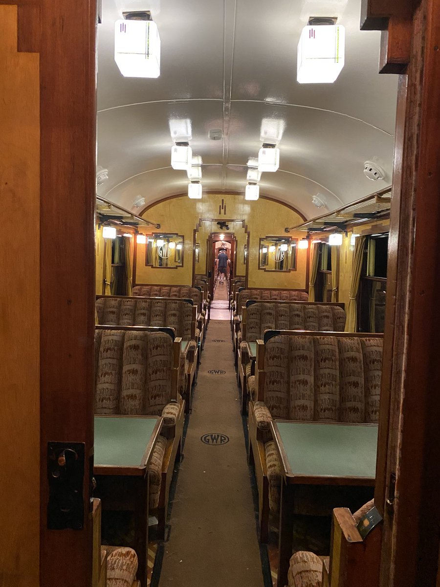 CrecyRail's tweet photo. Today’s office was the exquisite GWR brake No 650. With the lights on going through Bewdley tunnel, its beautiful art deco interior looks superb, you’d almost expect to see Hercule Poirot shuffling along the corridor. The exterior view certainly wasn’t taken today! Scorchio! https://t.co/6kBrJJrH3J