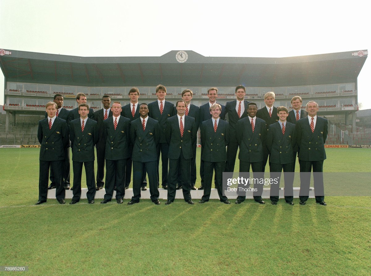 ThrowbackAFC's tweet photo. Arsenal players and staff in their Aquascutum blazers at Highbury, circa 1990. #throwbackthursday https://t.co/rz9x0AWbvR
