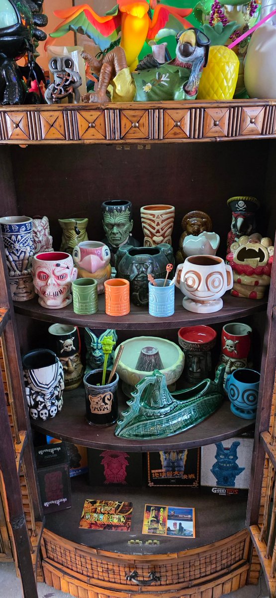 AnubisPaws's tweet photo. I got a couple new items for my Wild Times Tiki Bar. I bought the Tiki cabinet to display my collector Tiki Mugs. I also picked up the Tiki Room Parrot and realistic Stitch greeting those at the entrance. #tiki #stitch #parrot #tikibird #tikiroom #tikimug #jaws #toothless https://t.co/I6ByVyNKvk