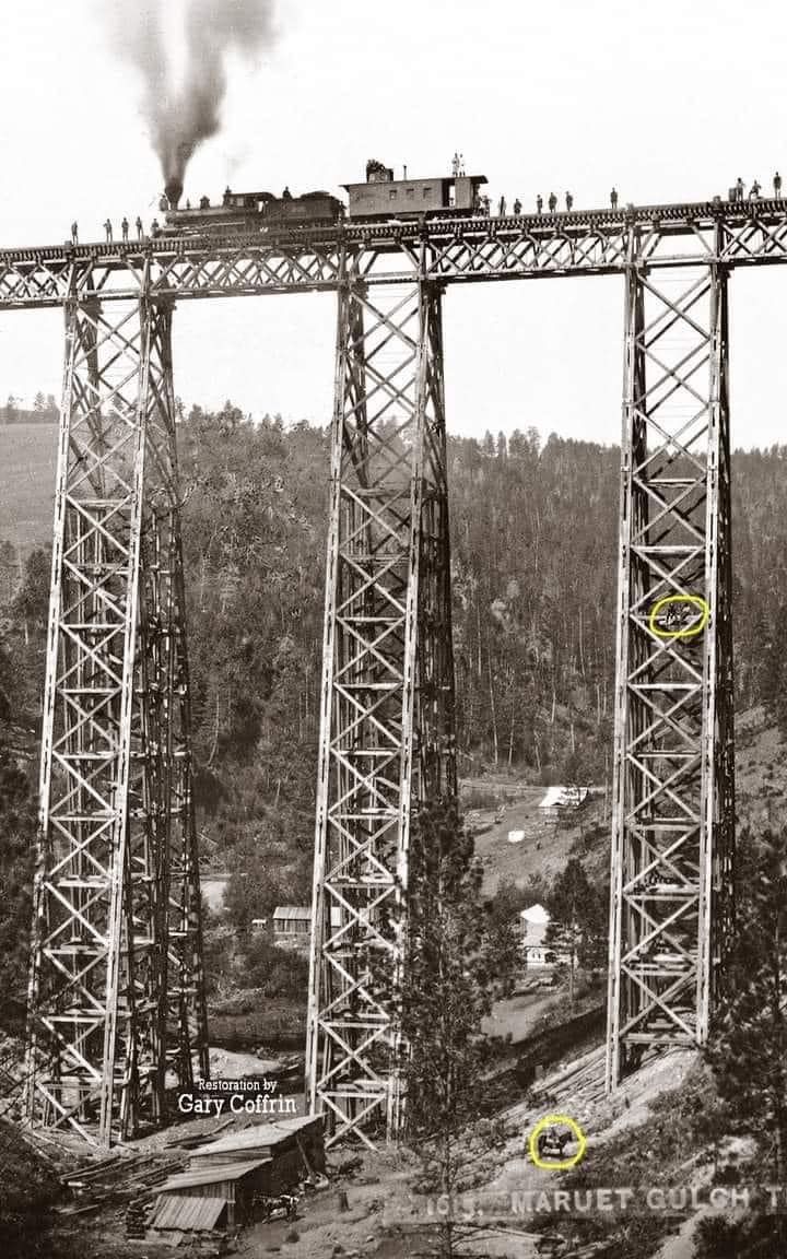 pastarchive's tweet photo. One of the tallest wooden railroad bridges ever built.
Wooden Railway Bridge. USA, Montana, 1883.

This is the original Marent Gulch Trestle in Montana, built for the Northern Pacific Railway in 1882–83. The wooden structure carried trains about 226 feet / 69 meters above the gulch, but its size also made it dangerously vulnerable to fire. By 1885, it had already been replaced with an iron bridge.

Look closely: the tiny figures on the trestle and near the base show just how enormous this 19th-century engineering feat really was.