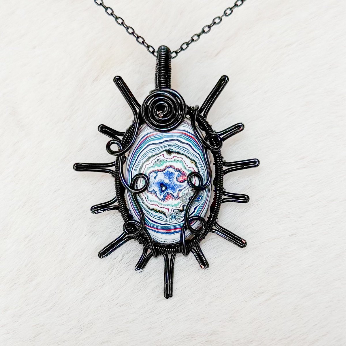 mildhippie's tweet photo. 30 minutes til my shop update 👀🌈🌞

this rare fordite sun along with many other pendants will be available then!!! https://t.co/1zvELUMWMv