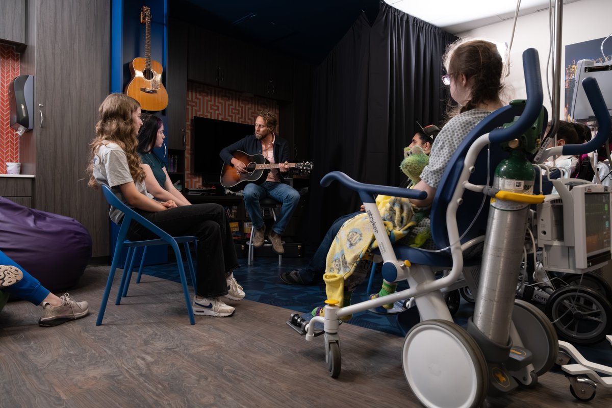 archildrens's tweet photo. 🎶🎸 Singer-songwriter and University of Arkansas graduate @BenRector surprised patients at Arkansas Children’s Hospital with a special jam session during his visit for the grand opening of our new main entrance! https://t.co/KIN8H2AckL