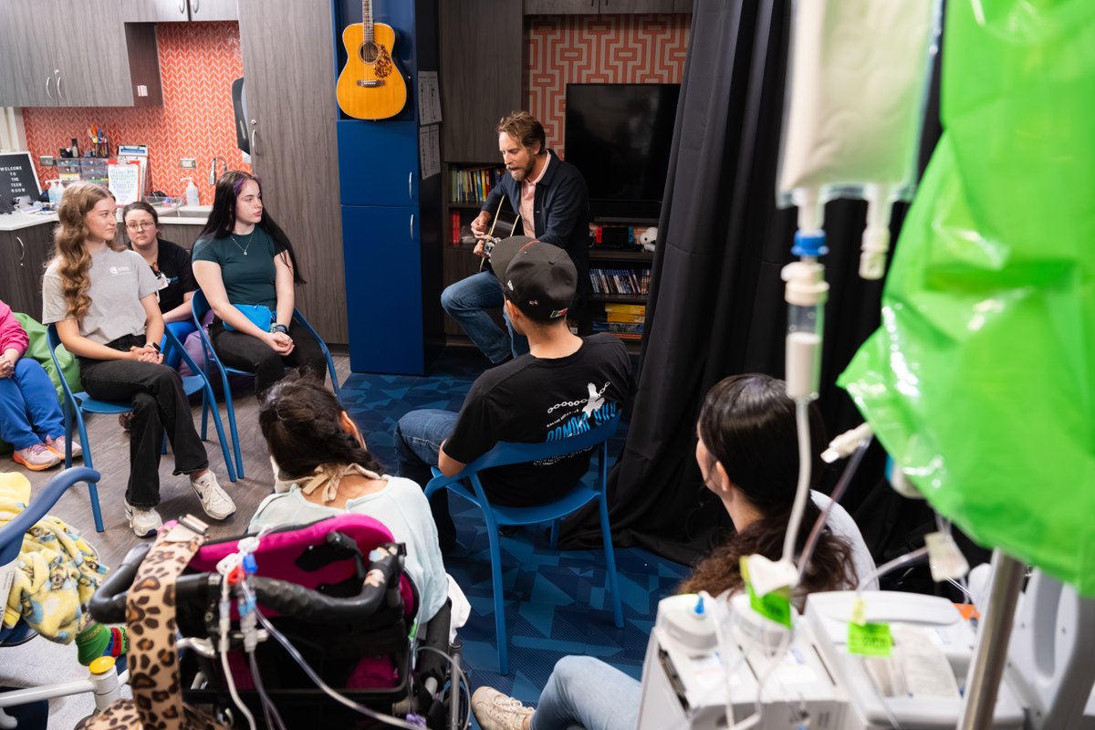 archildrens's tweet photo. 🎶🎸 Singer-songwriter and University of Arkansas graduate @BenRector surprised patients at Arkansas Children’s Hospital with a special jam session during his visit for the grand opening of our new main entrance! https://t.co/KIN8H2AckL