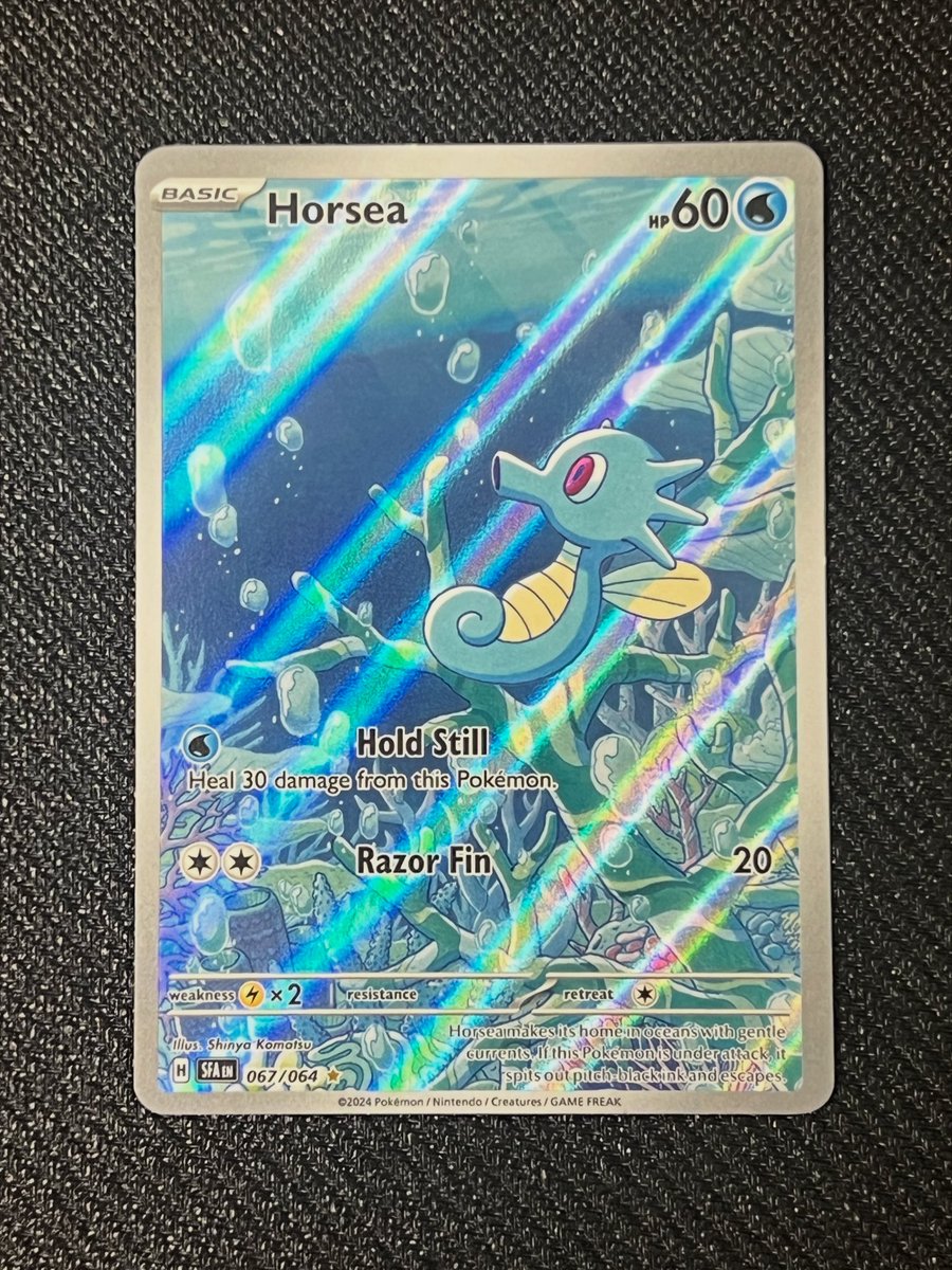 PokeKnox's tweet photo. I would absolutely catch a horsea and put it in a fish tank in my house 😅 Shrouded Fable has such good artwork on so many cards! https://t.co/X9lcTVPpaU