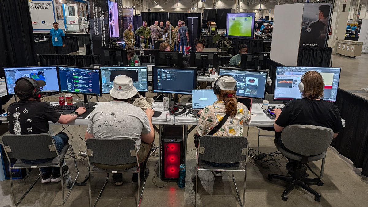 NCgameDev's tweet photo. Pretty awesome first day for the Niagara College team getting to demo the new @Skills_Canada game development competition! Yes that is a rocket launcher in the background!😄 #ncLife #NiagaraCollege https://t.co/cd2InWat9z