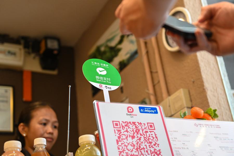Pacific_Dialog's tweet photo. Chinese tech giant Tencent has announced a landmark integration of its extensive payment network with PayPal, enabling U.S. visitors to pay like locals in China via QR codes.

Tencent's WeChat, which serves as a multifunctional app beyond just social media and messaging, offers digital payment services known as WeChat Pay. 

The PayPal QR-code payment service will allow travelers to make payments by scanning or being scanned at WeChat Pay merchants across the Chinese mainland. It will be initially open to U.S.-based PayPal users, with other international markets to follow.