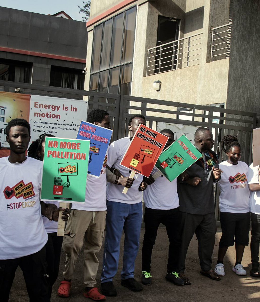 stopEACOP's tweet photo. Ahead of TotalEnergies AGM, activists in Uganda gathered outside the company's headquarters in Kampala in solidarity with the EACOP project-affected people. The contrast between corporate gain and community pain couldn't be sharper. #KickPollutersOut #StopEACOP #StopMozGas https://t.co/49ie0WybOp