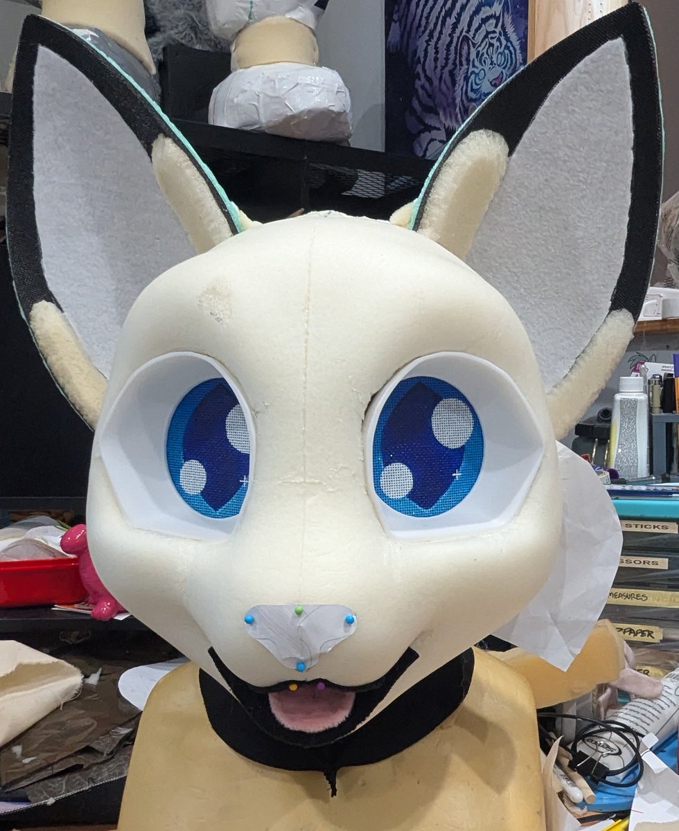 8Bit_Works's tweet photo. Add ears ➡️ Tape pattern ➡️ Copy pattern onto fur, cut out, then roughly pin to headbase to see what we have so far ➡️ Break for weekend 🎶 https://t.co/fHMqpaE1pX