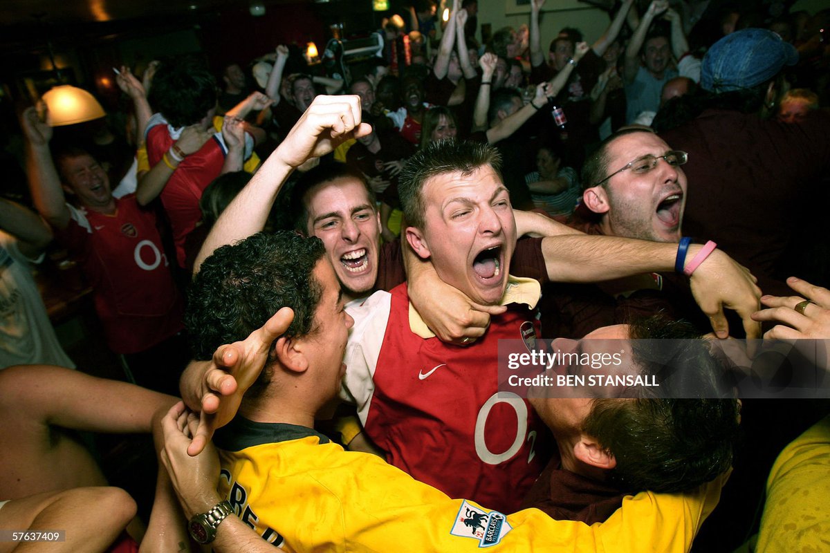 ThrowbackAFC's tweet photo. Arsenal fans in the Highbury Tavern and Gunners Pub celebrate Sol Campbell’s opening goal against Barcelona in the 2006 Champions League Final. https://t.co/E6rIMs6e7y