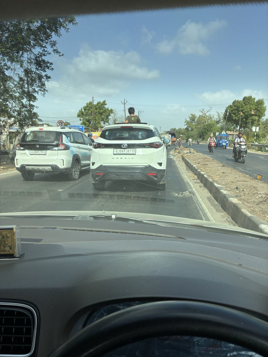mayank_marvania's tweet photo. @GujaratPolice Kindly take appropriate action against the vehicle owner regarding standing and poking head out of moving vehicle’s sunroof. Location - Sangma-Padra Road, Vadodara. Date- 29/05/2026, Time-9:09 AM. Vehicle no-GJ06PJ8715 https://t.co/PyO5BccUJg