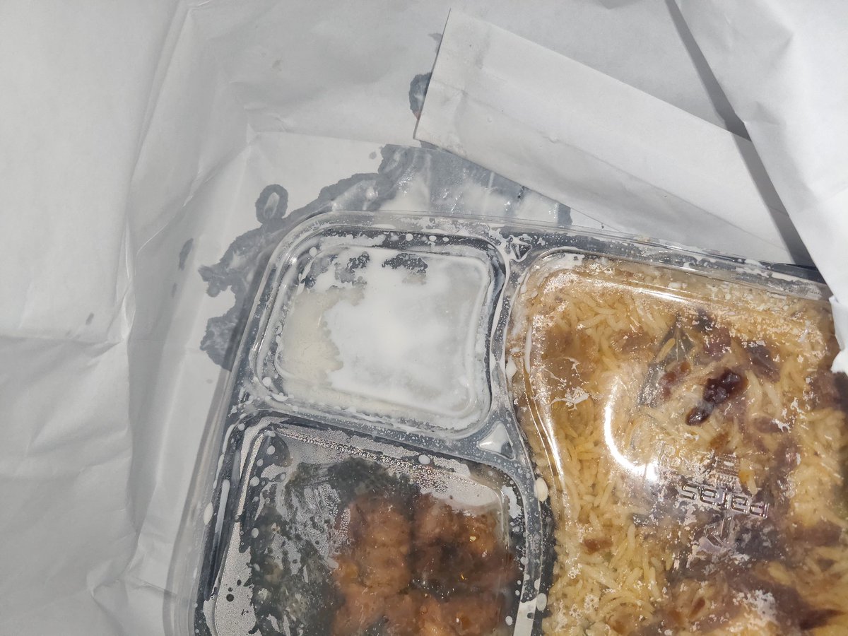 NomadicDr's tweet photo. @zomato @zomatocare 
I ordered from this restaurant and received poorly packed food. The food was spilling outside the container. Also, the menu mentioned Angoori Gulab Jamun, but it was not provided. In the biryani, 3 pieces were mentioned, but I received only 2 piece. Pathetic https://t.co/fLArajE0p1