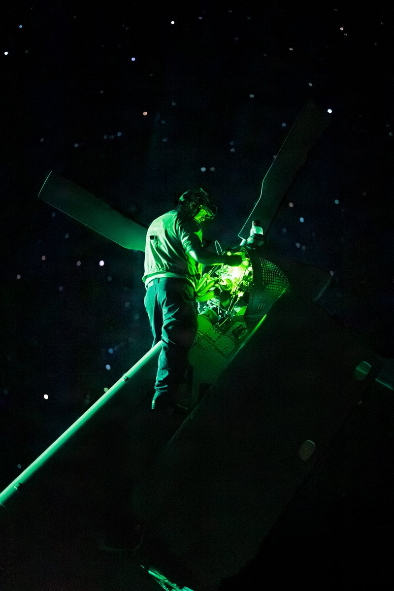 USNavy's tweet photo. Burning the midnight oil. 🌙🔧

Sailors assigned to the "Ghostriders" of Helicopter Sea Combat Squadron (HSC) 28 conduct maintenance on MH-60S Sea Hawk helicopters on the flight deck of the Blue-Ridge class command and control ship USS Mount Whitney (LCC 20).

Mount Whitney is in the U.S. 6th Fleet area of operations supporting the warfighting effectiveness, lethality and readiness of @USNavyEurope.

📸 MCC Chad M. Butler