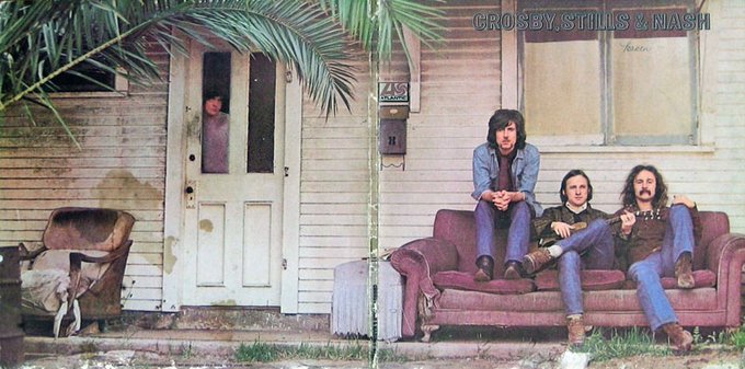 60sPsychJukebox's tweet photo. Crosby, Stills & Nash is the debut studio album by the folk rock supergroup Crosby, Stills & Nash (CSN), released on May 29th in 1969 by Atlantic Records. It is the only release by the band prior to adding Neil Young to their lineup. The album spawned two Top 40 singles, "Marrakesh Express" and "Suite: Judy Blue Eyes". 

The photo was taken by their friend and photographer Henry Diltz before they came up with a name for the group. They found an abandoned house with an old, battered sofa outside, located at 815 Palm Avenue, West Hollywood.

When they developed the picture they knew it was great. But they realized they were sitting in the "wrong" order. They considered reversing the image, but then the guitar would point the wrong way.  They went back the next day to re-take the picture, but the house was demolished.