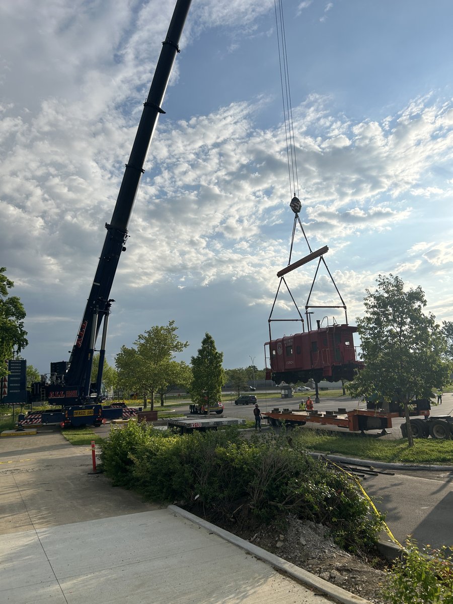 OHFacilities's tweet photo. The Ohio Village renovation project at the Ohio History Connection in Columbus remains on track – pun intended – with the recent move of the village’s bright red caboose to its final location. The reno project is scheduled for completion later this year. https://t.co/iX0L6oJQgE