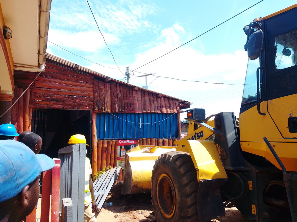 CountryRadio87's tweet photo. Born-again and Pentecostal churches, timber yards, stores, garages, pork joints, residential houses and toilets are among the most affected structures in the ongoing demolition of illegal and temporary structures during the enforcement of trade order in Rukungiri Municipality. https://t.co/PJLSH8NGFy