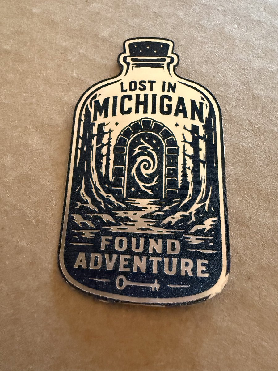 StateOfStick's tweet photo. Lost in Michigan… Found Adventure! Just designed &amp; laser-cut this bottle-shaped emblem in gold metallic acrylic. The perfect little portal for every Mitten State explorer
Who else gets lost on purpose in the woods? 
#Michigan #LostInMichigan #Adventure #LaserCut #MadeInMichigan https://t.co/hMbHQZLCv2
