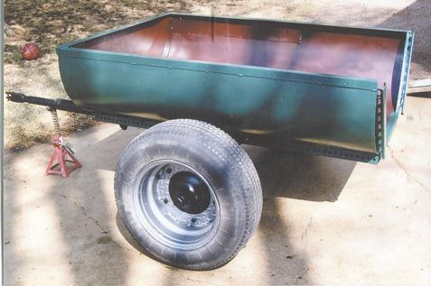 FarmShow's tweet photo. Cal Miner, Willmar, Minn.: "I cut a 265-gal. fuel oil tank in half and then welded bed frame angle irons around the edges to build this 2-wheeled trailer. Bed frames are made from springy, high carbon steel so you don’t want to use them on structural projects or they’ll crack, but they work good as an edge liner to hold the tank straight." https://t.co/CdSe7XxnA4