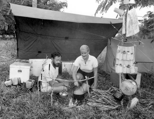 SFWMD's tweet photo. ⛺✨ No GPS. No Wi-Fi. Just a quiet day in the Everglades.

📸 This candid snapshot taken in 1959 shows a couple preparing a meal at a campsite in the Everglades.

💚 It's the perfect Florida adventure!

#America250FL https://t.co/Foj6H4o5r4