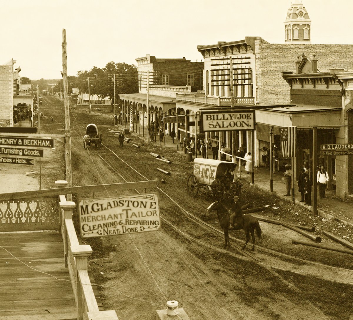 TracesofTexas's tweet photo. 3rd street in Lampasas during the 1880s. What an extraordinary photo. I see an ice wagon (isn't it interesting that you could get ice in Lampasas in the 1880s?), signs for M. Gladstone, a merchant and tailor, a sign for Henry and Beckham furnishing goods, a sign for R.D. Lauderdale, fine boots and shoes, and ---- last but not least ---- the Billy Joe Saloon.  I'd love to know if any of these buildings still stand.

From the fantastic Lawrence T. Jones III archive at SMU's Degolyer Library.