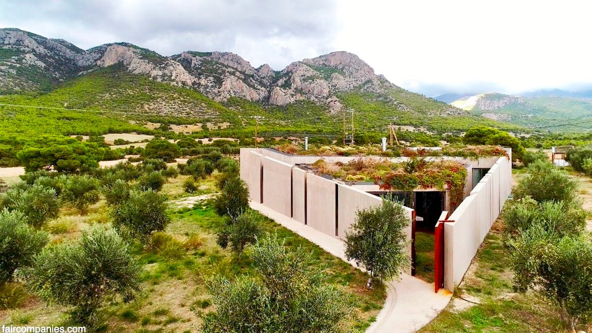 faircompanies's tweet photo. Can a triangle be a home? Tilemachos Andrianopoulos shaped this home around a Greek olive grove: low at its tip, growing uphill until it opens completely, so the trees come in, &amp; topped with a living roof of local plants. Watch the video by @kirstendirksen https://t.co/YUKJUS71qZ https://t.co/oMXSc7ZX5u