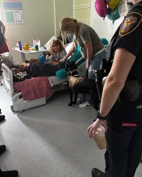 fortworthpd's tweet photo. Recently, a former FWPD officer reached out to our Fort Worth Cops for Kids to tell us about his neighbor, Emma.  Since the age of three, Emma has dreamed of becoming a police officer. The now 7-year-old Emma, recently began chemotherapy for treatment for lymphoblastic leukemia. Knowing she needed support, we arranged for a group of our female officers to surprise her.

Officers Oleksy, Castro, Espinoza, St. Clair, Bel Haddad and our Critical Incident Response Team (CIRT) K9 Echo visited Emma in her room, bringing along a police Build-A-Bear for her! Though initially shy, Emma lit up with a big smile when she saw K9 Echo, who rested her head on the hospital bed, comforting Emma and helping her open up.

Her parents expressed that they had not seen her smile like that in weeks, and that the moment left a lasting impact on the entire family.

Your Fort Worth Police Department family is standing behind you, future Officer Emma! Keep fighting hard!