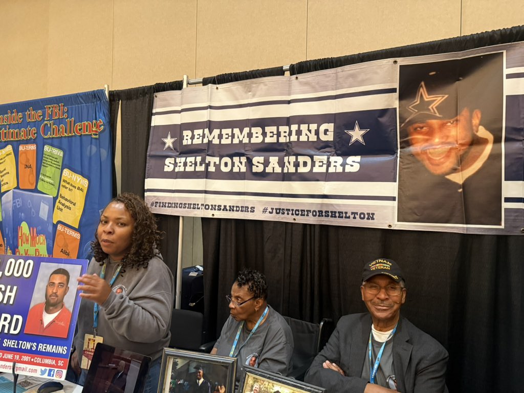 conlin_lauren's tweet photo. This sweet family has had a booth at every @CrimeCon since 2023. Their son and brother, Shelton Sanders, was murdered in 2001 in South Carolina. The case resulted in a hung jury because Shelton’s body was never found, and the alleged killer walks free today. For tips or ways to help, email findingsheltonsanders@gmail.com