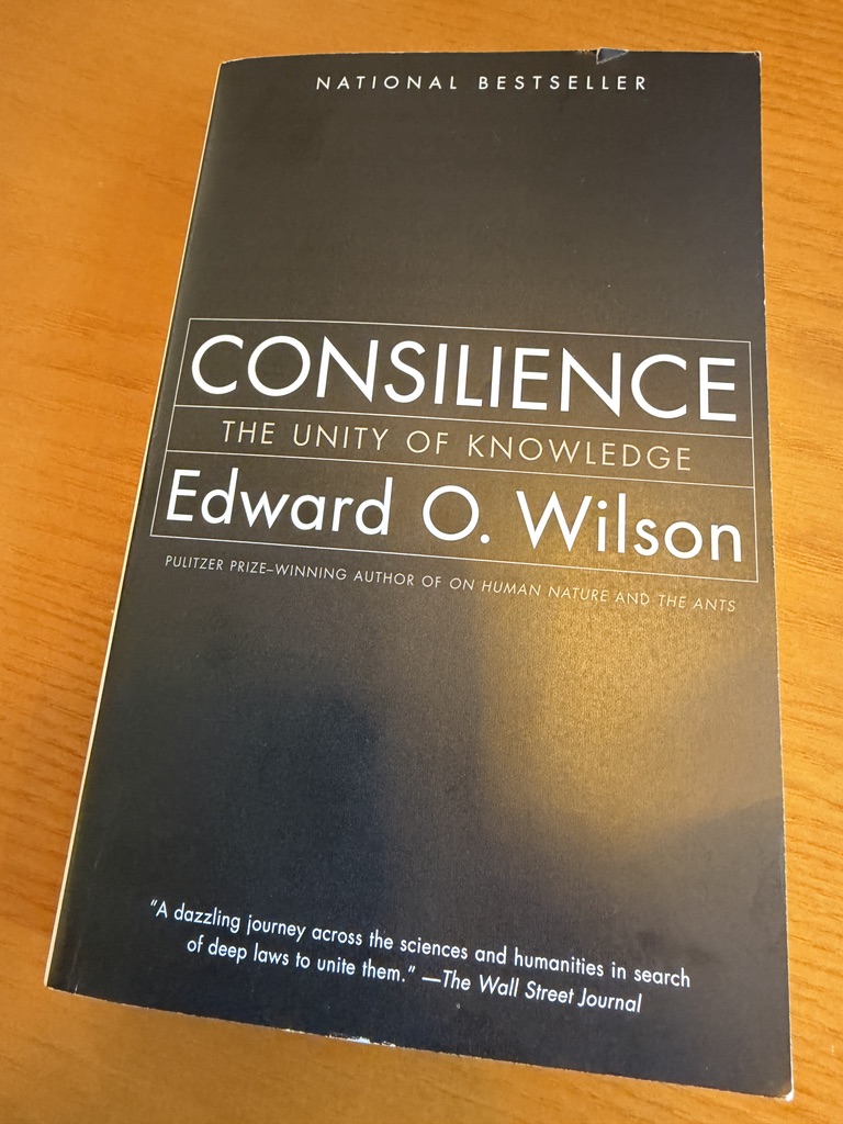 C_Hendrick's tweet photo. The most fascinating book I have read in a long time. It occurs to me that LLMs might actually be the strangest realisation of Wilson's whole project:  ie the kind of cross-disciplinary jumping he wanted,but arrived at by chewing through text rather than by the gene-culture biology he was talking about. So interesting.