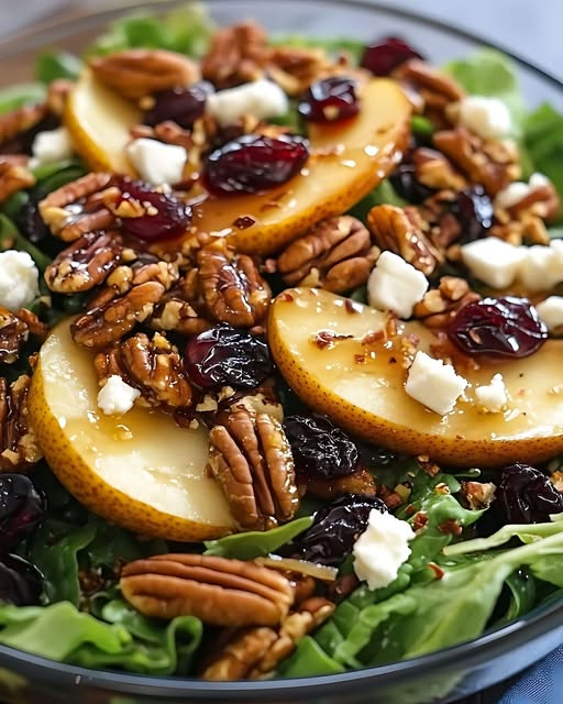 ann_ann886's tweet photo. Pear and Candied Pecan Salad with Balsamic Vinaigrette

Candied Pecans
Ingredients
4 tablespoons brown sugar
1 teaspoon ground cinnamon
Pinch of sea salt
1/2 teaspoon vanilla extract
1 tablespoon water
1 cup pecans
Instructions
In a skillet over medium heat, combine brown sugar, cinnamon, sea salt, vanilla extract, and water.
Stir until the sugar melts and begins to bubble.
Add the pecans and stir well to coat evenly.
Cook for 2–3 minutes until the glaze thickens.
Transfer pecans to parchment paper and let cool completely until crisp.

Balsamic Vinaigrette Dressing
Ingredients
1/4 cup balsamic vinegar
2 tablespoons honey
1 tablespoon mustard
1/2 teaspoon sea salt
1/2 teaspoon black pepper
1 garlic clove, minced
3/4 cup olive oil
Instructions
In a bowl or jar, whisk together balsamic vinegar, honey, mustard, garlic, salt, and black pepper.
Slowly drizzle in the olive oil while whisking continuously.
Continue whisking until the dressing is smooth and emulsified.

Salad
Ingredients
10 ounces mixed baby greens
1 pear, sliced
1 cup dried cherries
1 cup candied pecans
1/3 cup crumbled feta cheese
Balsamic vinaigrette, to taste
Instructions
Place the mixed greens in a large salad bowl or serving platter.
Top with sliced pear, dried cherries, candied pecans, and feta cheese.
Drizzle with balsamic vinaigrette.
Toss gently before serving. See less