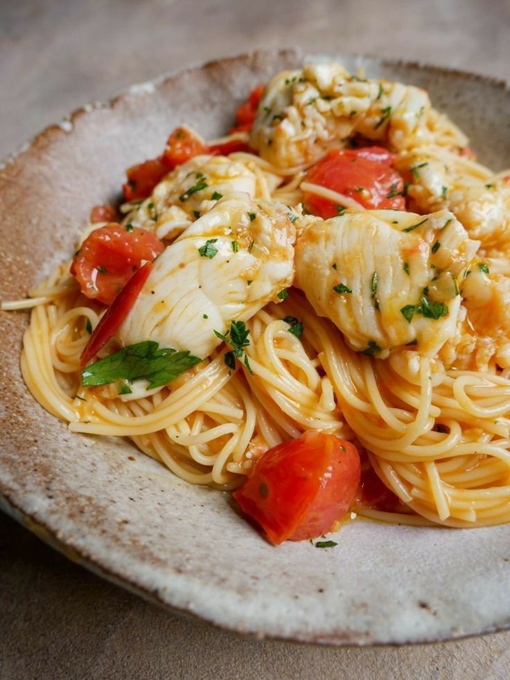 ann_ann886's tweet photo. Buttered Lobster Pasta

Ingredients
Pasta
12 oz spaghetti or linguine
Salted water for boiling
Lobster
2 lobster tails (or 1 lb cooked lobster meat)
1 tsp paprika
Salt and black pepper
1 tbsp olive oil
Garlic Butter Sauce
6 tbsp butter
5 garlic cloves, minced
1 pint cherry tomatoes, halved
½ cup white wine or seafood broth
Juice of ½ lemon
¼ tsp chili flakes (optional)
2 tbsp chopped parsley
¼ cup reserved pasta water

Instructions
Cook the pasta
Bring a large pot of salted water to a boil.
Cook pasta until al dente.
Reserve ¼ cup pasta water before draining.
Prepare the lobster
If using lobster tails, remove the meat from the shell and cut into chunks.
Season lightly with paprika, salt, and pepper.
Cook the lobster
Heat olive oil in a large skillet over medium-high heat.
Add lobster and cook about 1–2 minutes per side until opaque.
Remove immediately and set aside.
Make the butter sauce
Lower heat to medium.
Melt butter in the same pan.
Add garlic and sauté for 30 seconds until fragrant.
Cook tomatoes
Add cherry tomatoes and chili flakes.
Cook 3–4 minutes until softened and juicy.
Add liquid
Pour in white wine or seafood broth and lemon juice.
Simmer 2 minutes.
Combine
Add cooked pasta and reserved pasta water.
Toss until glossy and coated.
Finish
Gently fold lobster back into the pasta.
Sprinkle with parsley and serve immediately.

Tips
Don’t overcook lobster or it becomes rubbery.
Add extra butter at the end for a silky restaurant-style sauce.
Fresh parsley and lemon brighten the rich buttery flavor.
Delicious with garlic bread and a chilled white wine.