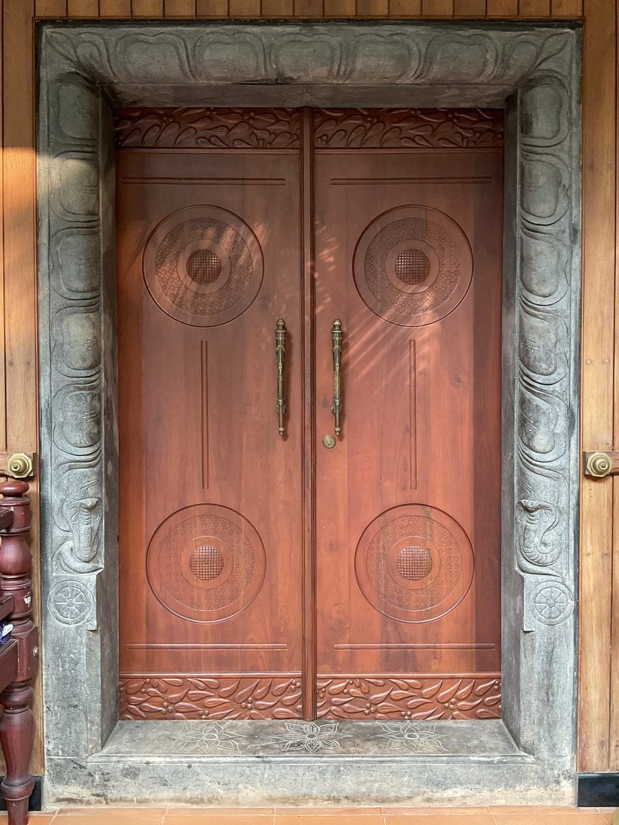 DamonZumbroegel's tweet photo. Doors I’ve Designed -  When it comes to the openings in a structure, I treat them with great respect.  They are the “portals” from the outside world……in.  They are the “transitions” from one place to the next. In every culture I travel to, in every place I have dug deeply, the doorway plays a significant role not only in the home, but in the culture itself.  
Pay special attention to your “doors and doorways”, they are truly an integral piece in the very procession of Life, and transitioning from the outside into your abode.  

-Door to the Shrine Room
-Sreenilayam Ayurvedic Center, Kerala, India
-Teak and Granite