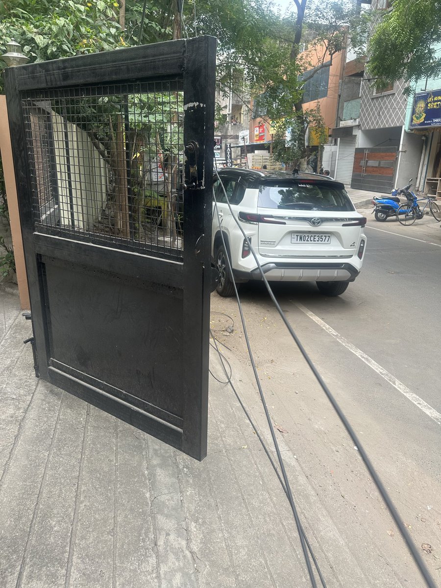 imkirankumar's tweet photo. @chennaicorp These thick cables are blocking my entire entrance and making it impossible to take my car out safely. The workers here don’t bother removing them despite repeated requests. This is daily harassment! Need immediate action from authorities.Trustpuram 1st Cross Street https://t.co/2mklCe50fg