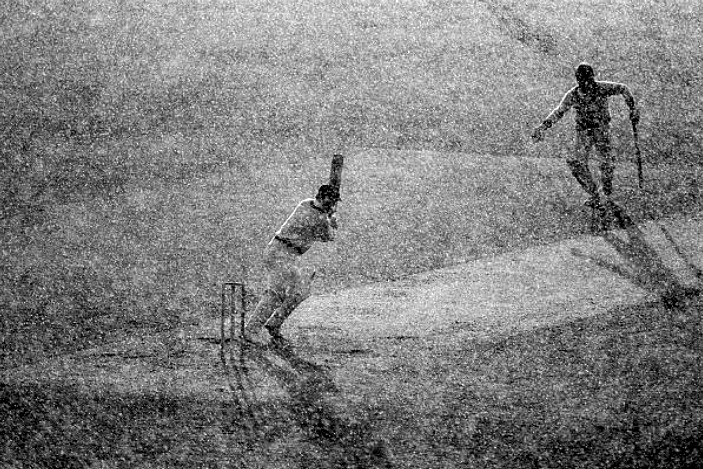 PictureSporting's tweet photo. Greg Chappell batting in torrential rain, Prudential Cup, The Oval, June 6th 1977. Patrick Eagar's picture  captures the absurdity of the finish of the ODI in low, evening sunshine and driving rain.  Water was dripping off the caps of the fielders and batsmen and drying the ball was pointless. Both sides agreed to play to the end as they did not want to come back the next day to finish the game, as was usual back then, as it was the Queen's Silver Jubilee celebrations in London