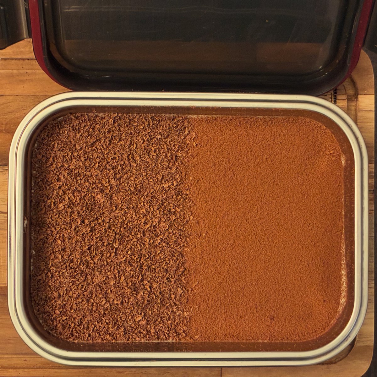 apnerve's tweet photo. Nailed the layering and unable to stop myself from spamming on all my accounts 😂. The left half is shaved dark chocolate and the right is cocoa powder. Experimented with strawberry Saviordi biscuits for the base and coffee from a free sample I got from a micro roastery nearby https://t.co/7tF6YNE9Ng