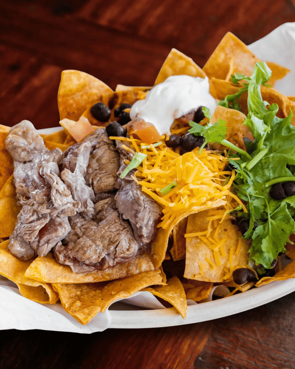 darrenedavis's tweet photo. Nachos just got a promotion.

Fresh chips piled high with butter-grilled filet mignon, melty cheese, beans, cilantro, and tomato… yeah, this is not your average plate.

That's "Mexican, with a splash of soul!"

Come try them today.
https://t.co/6oMXc2jRr8

#SkysGourmetTacos https://t.co/NHNB5Bn53H