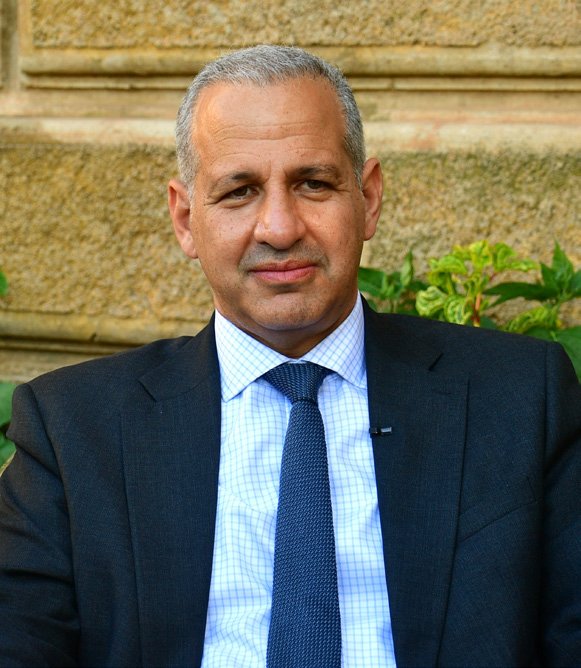 shabait's tweet photo. “Asmara Is Not Only the Capital, It Is a Pride of UNESCO”: An Interview with UNESCO’s Mr. Mohamed El Faranawy

By : - Sabrina Solomon

Mr. Mohamed El Faranawy, Acting Assistant Director General at UNESCO for Priority Africa, is currently on a working visit to Eritrea. As part of his trip, the senior official who oversees UNESCO’s flagship “General History of Africa” project and champions youth coding initiatives across the continent has met with high-level Eritrean officials and toured Asmara, a UNESCO World Heritage site, as well as other cultural landmarks. Upon concluding his visit, Mr. Mohamed El Faranawy sat down with Eri TV’s Rafael Giuseppe and Eritrea Profile’s Sabrina Solomon. Excerpts of the interview follow.

- Mr. Mohamed El Faranawy, you have met with several government officials. How do you assess your meetings and visit to Eritrea so far, and what specific goals do you hope to achieve to strengthen cooperation in heritage protection and sustainable development?

Thank you very much. It’s a pleasure to be here. This is my first visit to Eritrea, hopefully not my last. From UNESCO, we see great potential in Eritrea. I bring the greetings of UNESCO’s Director General, who is keenly interested in prioritizing engagement not only in Africa (which is one of the two priority areas of UNESCO) but is also keen on seeing how to develop the relationship with Eritrea and how to support Eritrea on cultural heritage, and also a number of other aspects that are within the UNESCO goals. The meetings have also shown that UNESCO is back to engaging with Eritrea, and we look forward to building on this collaboration. We also look forward to rebuilding and strengthening the relationship over the months and years to come.

- Asmara was inscribed as a UNESCO World Heritage site in 2017. How do you assess its current state of conservation, and what support can UNESCO offer to enlist other sites and intangible heritage in Eritrea?

Asmara is not only the capital of Eritrea. It is also a pride of UNESCO in terms of cultural heritage. It is a city that has great potential, but also showcases throughout the continent and globally what a modern city is and how it can be conserved and protected. We hope that after nine years of its inscription, we can collaborate more closely with officials here, and I have the specific directions of the UNESCO leadership to see how we can support Asmara, and showcase it as a proud capital of Eritrea and a proud heritage site of UNESCO. We are looking— we have discussed and will continue discussing with Eritrean officials about their priorities, what they would like to inscribe both in terms of tangible and intangible cultural heritage. We know there are a few sites on Eritrea’s radar that it would like to prioritize. Eritrea has Asmara to offer, but it also has a whole host of other activities, sites, and locations that showcase the heritage, history, and culture of Eritrea and its people.

- You have worked on several projects for Africa, including the Pan-African General History of Africa project. How can Eritrea’s unique historical narrative be better integrated into this narrative?

The General History of Africa is a series of well-thought-out and well-written volumes by Africans on Africa. Eritrea is an integral part of this continent. It is reflected in the volumes of the General History of Africa throughout the years. We would like to work with the Eritrean authorities, and we intend to collaborate and discuss with them the potential for translating the volumes of the General History of Africa and the pedagogical material into the school system in Eritrea. We have a number of examples throughout the continent to really put forward the history of the people of the continent to students, youth, and the people, and to help them learn more about their culture and be proud of their heritage and history.

- Eritrea recently ratified the 2003 Convention for Intangible Heritage. Looking ahead, which areas (education, science, or culture) hold the most promise for deeper UNESCO-Eritrea collaboration?

We think that Eritrea and UNESCO can collaborate throughout the scope of UNESCO’s mandate. It ranges, as you mentioned, from education to culture to science and technology. We see great potential for collaboration on girls’ education, working on digitalization, and working together on heritage protection. And we believe that this country has great potential for collaboration within the context of existing conventions to which Eritrea has signed, as well as outside that context. We are here, and my presence, along with the regional director, is here to present to you what it is we can work on, and we have already agreed on a timeline of engagement within the context of UNESCO’s mandate on certain aspects of higher education. We will have meetings with the Minister of Education as well; we’ve had meetings with a number of principals from the Foreign Ministry to the Ministry of Information to Culture, and we believe that each of those key entities of the Eritrean government has great potential to work closely with our institution. And UNESCO is ready to bring all of its capacity to bear.

- During your visit to some sites in Asmara, what impressed you the most?

Unfortunately, because of time constraints, I have been limited to Asmara. But I know, and I am aware that Eritrea has a lot more to offer. What I saw in Asmara reflected deeply the jealousy my colleagues felt when I told them I was coming to Eritrea. They were not only curious but also wanted to know more and wanted to engage in the various competencies of UNESCO, be it in heritage or education. And I can tell you that what I have found as most striking is the people of Eritrea and how friendly, how welcoming, how warm they are, and how much this country has to offer in terms of tangible and intangible heritage and in terms of tourism, with all that it has to offer, along with its beautiful people and weather. You are a very lucky people; you have great potential, and with the wisdom of the leadership and the support of UNESCO and other organizations that would like to support this country, we believe that what you have to offer can really be showcased not only as the pride of Eritreans but also the pride of the international community.

- Is there anything that you would like to add, or any message you wish to convey to our readers?

As long as we are welcomed in #Eritrea, we are happy to engage, happy to support, and we will offer it to various other entities for the people of Eritrea, because UNESCO is UNESCO for the people, and we are proud to support and help the people of this country.

- Thank you, Mr. Mohamed.