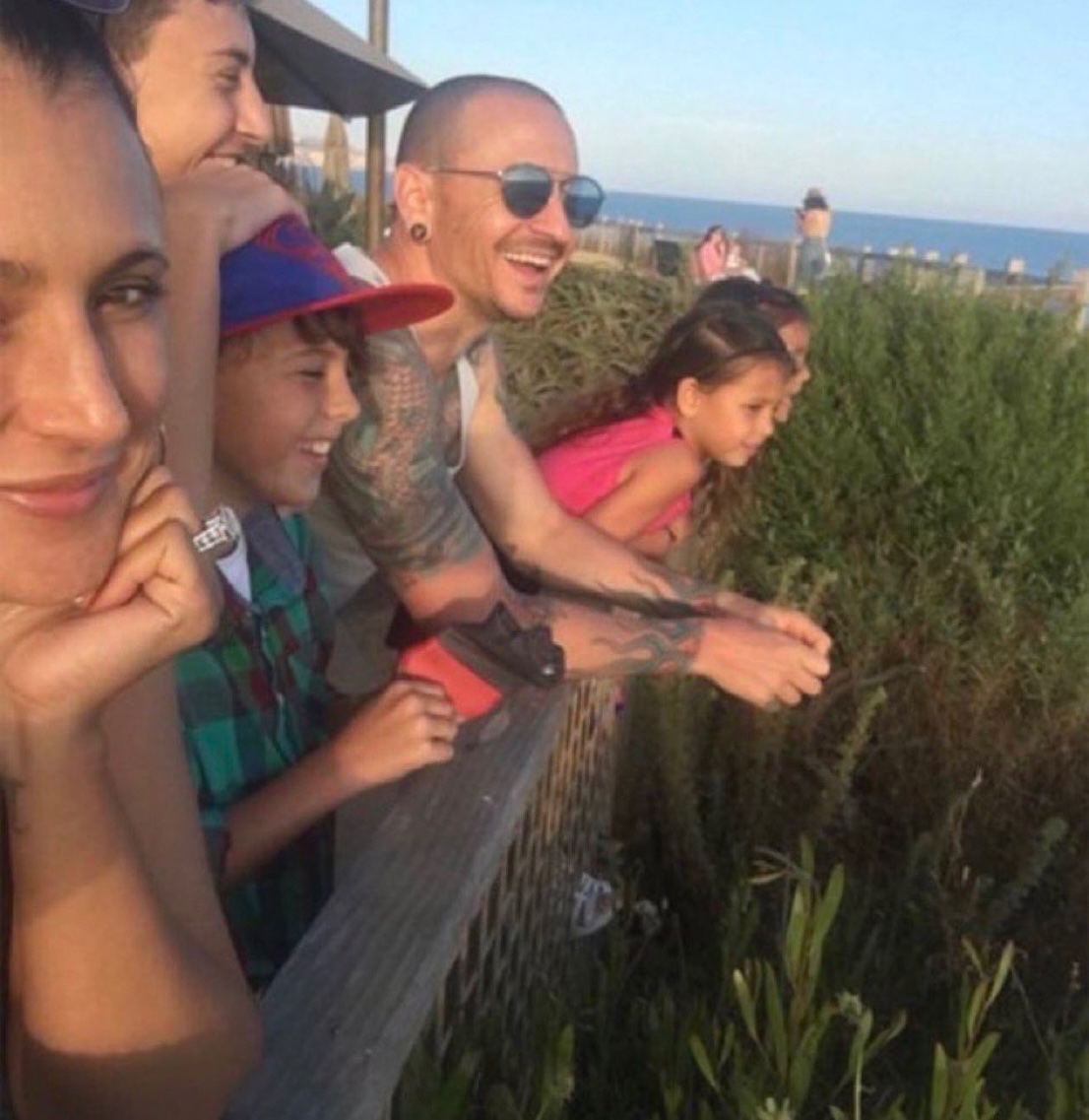 historyrock_'s tweet photo. The last photo of Linkin Park’s Chester Bennington, taken by his wife just 1 day before he took his own life.

On July 20, 2017, Chester Bennington, 41, was found dead at his home in Palos Verdes Estates, California. 

His housekeeper discovered him shortly before 9 a.m. in the bedroom, hanging from the door with a black Hugo Boss belt. The death was ruled a suicide by hanging.

That day coincided with the birthday of his close friend Chris Cornell (lead singer of Soundgarden and Audioslave), who had died by suicide two months earlier, on May 18, 2017. 

Chester and Chris were very close, and Chester had sung at Cornell’s funeral. He left no suicide note. The toxicology report showed only a small amount of alcohol in his system and an empty beer bottle in the room, but no other drugs.

Chester had struggled his entire life with depression, anxiety, substance abuse, and childhood trauma (including sexual abuse he suffered as a child). Although he seemed to be in a good place (they had just released the album One More Light and he had been spending time with his family), his widow Talinda later mentioned that there had been warning signs in the days leading up to his death, even though he seemed happy the night before.

His death shocked the music world. Linkin Park released an official statement, and the band held a tribute concert months later. Chester left behind six children from his two marriages.
It is a very sad story that once again brought the spotlight to mental health in rock music and among musicians.