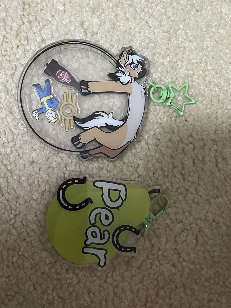 ThatFjordPear's tweet photo. I love these keychains so much the pear one was a present from my lovely friend sparkymelon on insta thank you so much always love the art you gift me. Other artist I’ll put in comments I forgot their insta. #furry#furrsuiter#fursona https://t.co/blYlSFw7LR