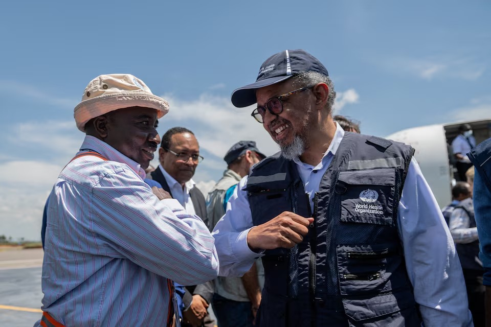 MarioNawfal's tweet photo. 🇨🇩 The DRC's 17th Ebola outbreak has no approved vaccine, no approved treatment, and over 1,000 suspected and confirmed cases.

WHO chief flew into Bunia, the epicenter, to build community trust and urge neighboring countries to lift travel bans that hamper transparency.

Meanwhile, response teams are pushing for safe burial practices after cultural traditions kept driving new infections.

Over 225 confirmed dead and climbing. The global response is already being outpaced by the spread, and this is now the third-largest Ebola outbreak since the virus was discovered 50 years ago.

Source: Reuters