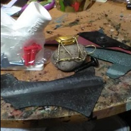 CatKyre's tweet photo. Had to do repair work on this crow I did 2 years ago because the clay dried out and crumbled. I resculpted him + repainted. Also had to fix a 3D picture I did of 2 woodpeckers because it also fell apart.  Both pieces are made with assorted car parts that I found on the streets. https://t.co/LTSn1213ms