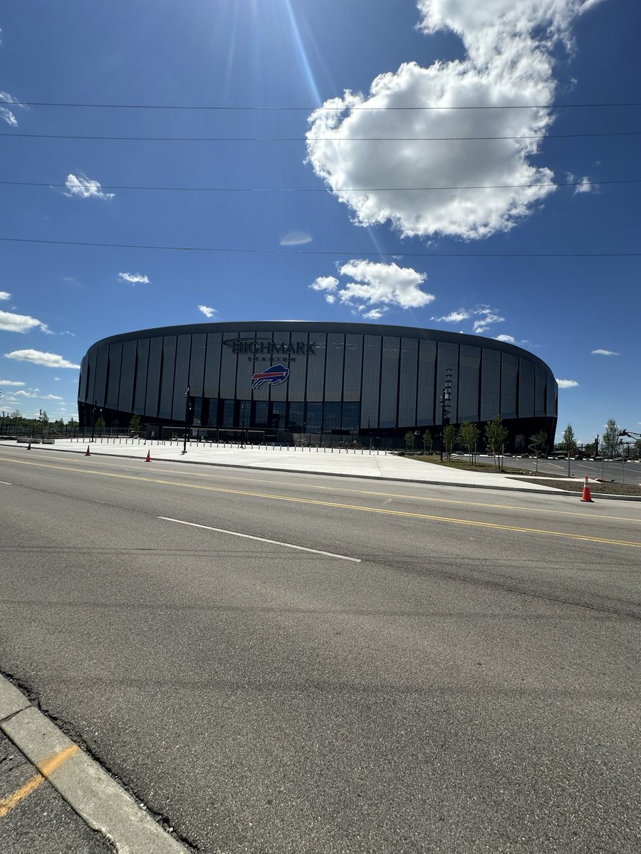HammersLot's tweet photo. No sooner than the last of the black topping was done, the temp security gates went down in parts, fans roaming (like buffalos) around the east side of stadium. #stadiumconstruction #billsmafia #GoBills @WBEN @WGRZ @WKBW @WGR550 @news4buffalo @news4buffalo https://t.co/GBT4G0YDak