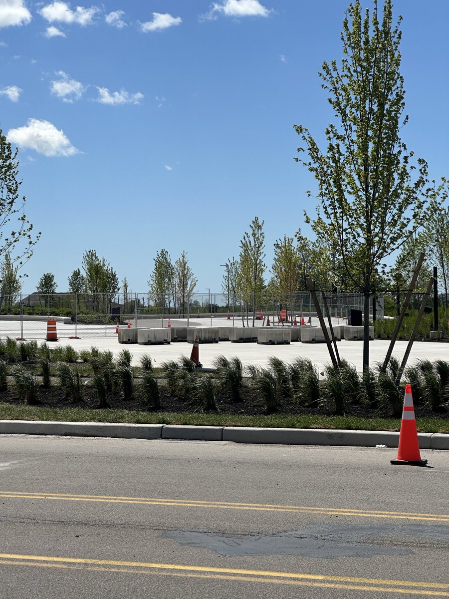 HammersLot's tweet photo. No sooner than the last of the black topping was done, the temp security gates went down in parts, fans roaming (like buffalos) around the east side of stadium. #stadiumconstruction #billsmafia #GoBills @WBEN @WGRZ @WKBW @WGR550 @news4buffalo @news4buffalo https://t.co/GBT4G0YDak