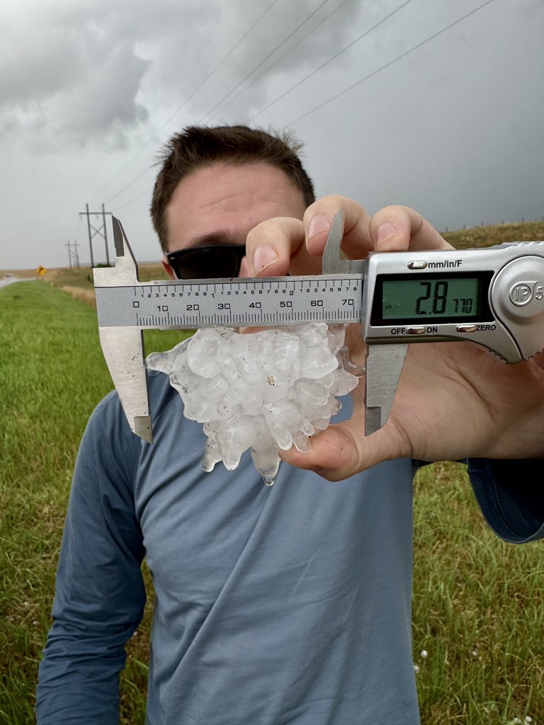 tuckerweather's tweet photo. Between baseball and hockey puck sized hail on the ground just north of Wellfleet, NE @NWSNorthPlatte https://t.co/EnzwsZFj0O