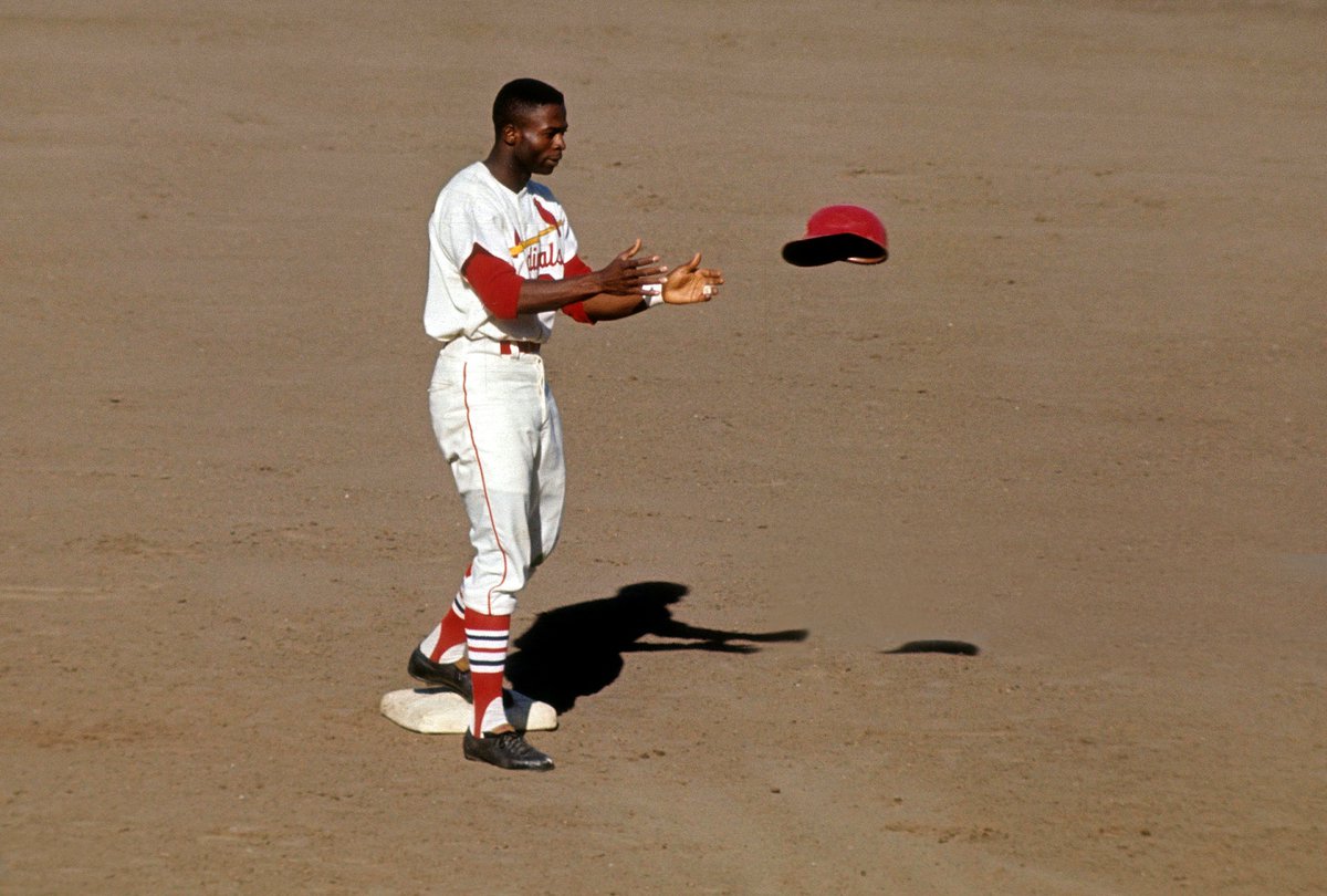 AugieNash's tweet photo. Not only could Lou Brock steal bases, his helmet levitating skills were unmatched.

#STLCards https://t.co/2TDorF3BDH