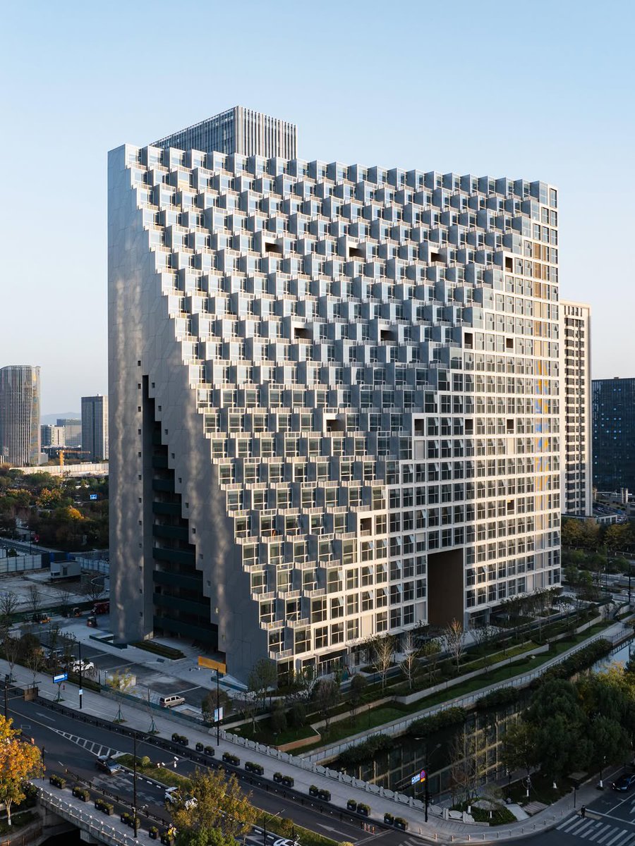UnthinkableBld's tweet photo. Xinhu Hangzhou Prism by OMA in Hangzhou is a mixed-use tower with a faceted, prism-inspired glass form that integrates offices, residences, retail, and public spaces into a landmark CBD development.
@parametricarch 
 #Architecture #Hangzhou #OMA https://t.co/3ZQqGcbzqb