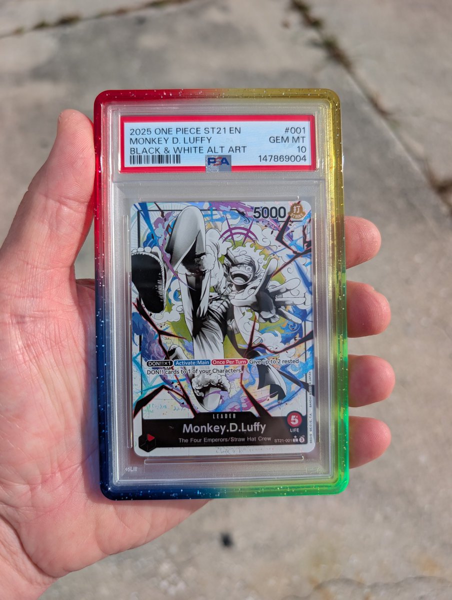Curt941's tweet photo. One Piece @PSAcard slabs that look good in the @GradedGuard x @eBay "Aura" colorway https://t.co/uAeOviqC5S