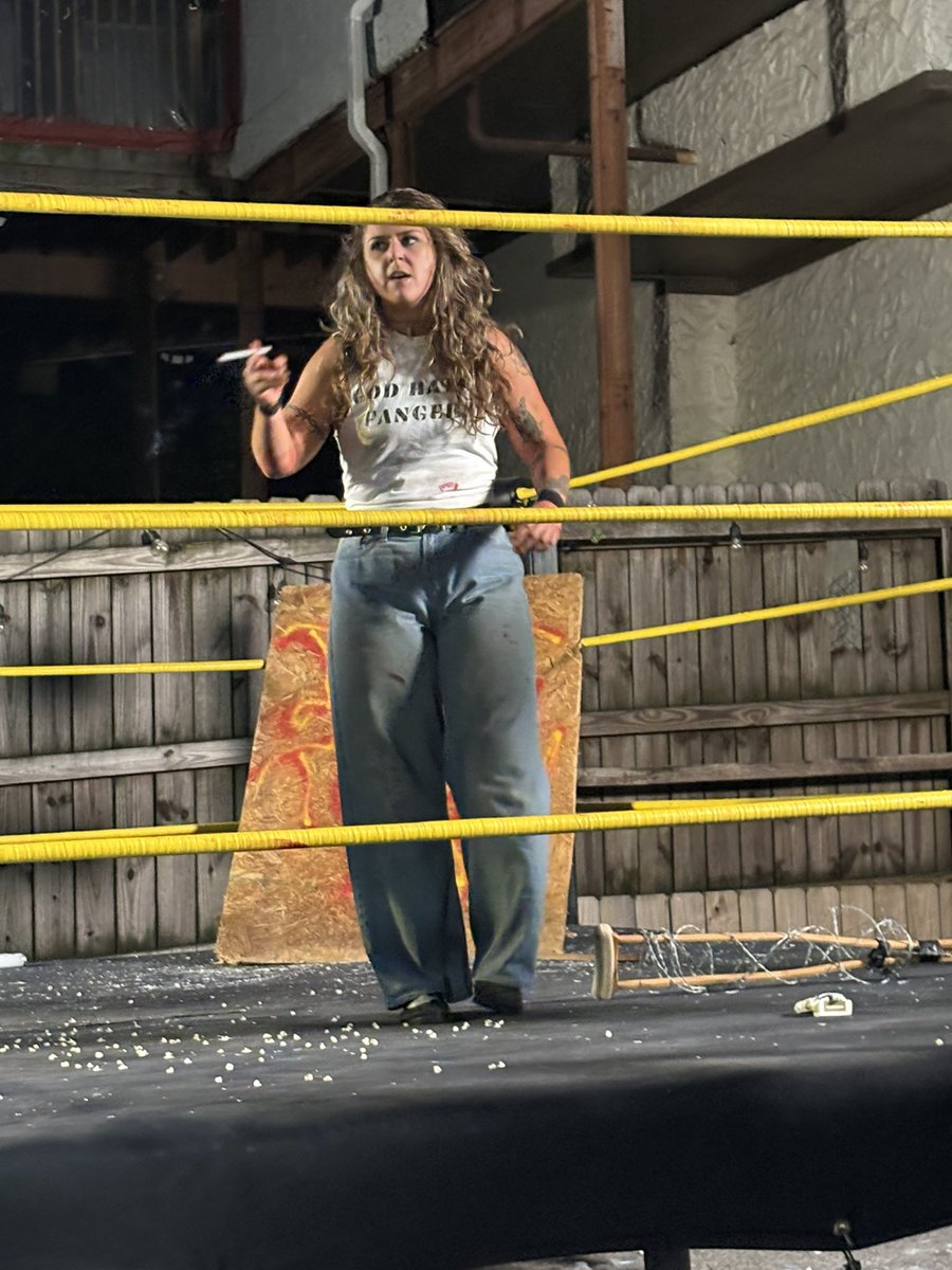 BostonNooga's tweet photo. Bobbi Thunder is my new favorite wrestler, she did a Christian conversion gimmick and ripped a Marlboro mid-match (the shirt says "God hates fangers" because she was wrestling a vampire, calm down) https://t.co/p0SJUzAXHy