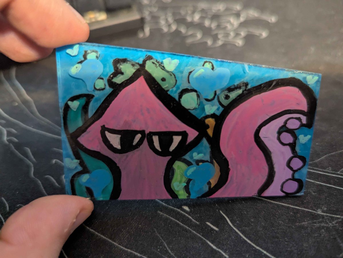 LythKross's tweet photo. A few days ago my niece came up and went "Hey, you like Squids. I made this for you" and handed me this.  The side with the coral shows in the background of the squid side of the glass. It's baller as frig :] https://t.co/zZNodeoZHs