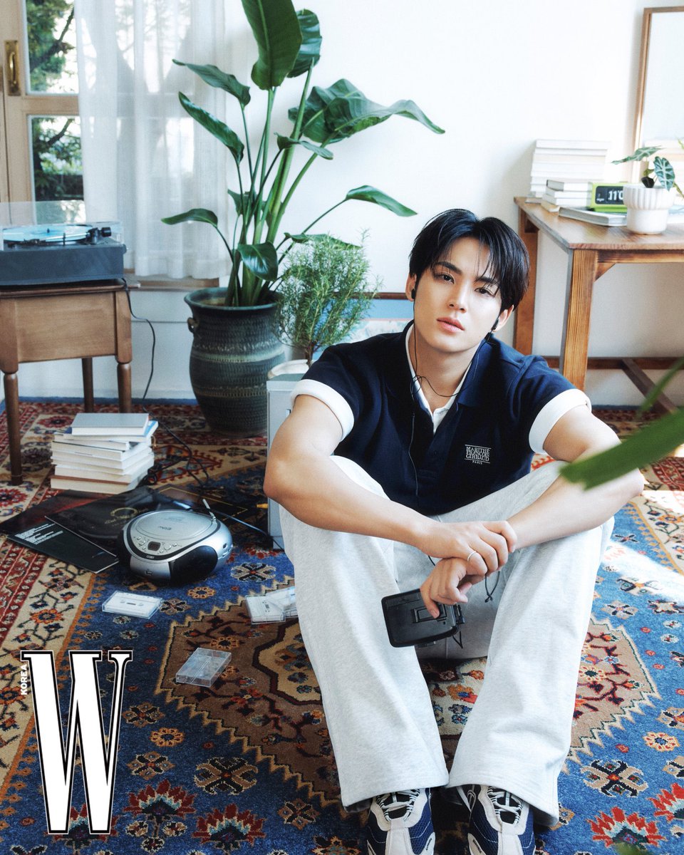 Maingyu's tweet photo. The sunlight and the breeze slips quietly through the window. Just me, sitting on the floor, surrounded by old playlists and songs that somehow understand exactly what I can’t put into words. Maybe that's what this photoshoot was trying to capture: a sense of comfort. https://t.co/ODdQHt7MEZ