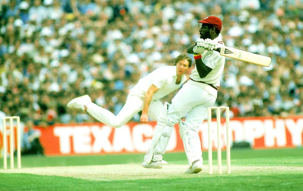 ABsay_ek's tweet photo. On this day 42 years ago, Viv Richards walked out at Old Trafford in 1984 with pterygium, an eye disease that made the cricket ball look like a smudged coin. Doctors had already cut into his eyes. He batted without a helmet because he thought helmets were for people who feared things & Richards feared nothing except maybe being ordinary.

West Indies were collapsing at 102 for 7. Haynes run out fot 1. Greenidge caught at 9. Gomes bowled on 4. Lloyd gone for 4. Dujon out for a duck.. Richards was on 70 something when lunch break arrived. Not a single dismissed batter in top 7 had reached double figures. He walked into dressing room & told his team that pitch was excellent. Problem was them. Then he turned to Eldine Baptiste & said, just stay. 29overs left. just hang around.

Baptiste made 26 & left. Joel Garner made 3 & left. At 166 for 9, Michael Holding walked out. Same Holding who had bruised Englishmen at this very ground 8 years ago with raw pace. Now he was a shield. Richards took 54 of the last 81 balls & scored 93 runs alone. Holding faced 27 & made 12*. They added 106 runs for 10th wicket. Still the highest in ODI history. Richards finished on 189* from 170 balls. He had made 69.48% of his team's runs.

England were chasing 273. They made 168. Same total West Indies had when Holding joined Richards. Richards also took 2 wickets because apparently one discipline was not enough.

Numbers say it was the greatest ODI innings ever. Wisden put it at top og their 100 greatest innings. But the real story is a man with damaged eyes playing like he could see the future. A man who had said no to  blank cheque offers from rebel tours of apartheid South Africa twice, who had been suspended as a teenager after a riot, who learned the game in a bar owner's borrowed whites.
He made 189 runs while his teammates made excuses. And when it was done, he probably just put his bat in kit bag & asked what was for dinner.